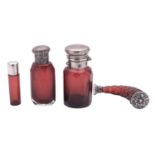 A late 19th/ early 20th century red cut glass scent bottle, horn-shaped,