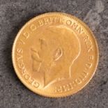 A George V half sovereign, bare head, reverse with St George and The Dragon,