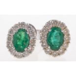 A pair of emerald and diamond cluster earrings,