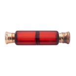 A late 19th century silver-gilt mounted red cut-glass scent bottle, with dual-compartments,