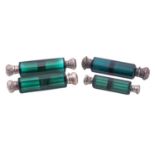 Four late 19th/ early 20th century silver mounted green cut-glass scent bottles,
