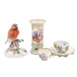 A group of Meissen porcelain comprising: a small lobed cabinet cup and saucer applied and painted