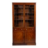 A Regency mahogany and ebony strung library bookcase,