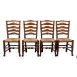 A set of six oak and rush seated ladder back dining chairs, in 18th century style,