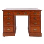 An oak pedestal desk in George III style,