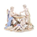 A Meissen group of the Bindfolded Cupid with two putti,