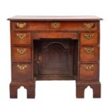 A George II oak and crossbanded kneehole desk ,