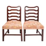 A pair of George III mahogany side chairs,
