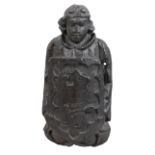 A 17TH CENTURY CARVED OAK ANGEL HOLDING A SHIELD.