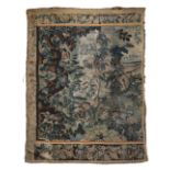A 17TH CENTURY VERDURE TAPESTRY DEPICTING A FOLIATE SCENE WITH BIRDS.