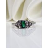 ANTIQUE ART DECO PLATINUM EMERALD AND DIAMOND RING