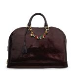 Louis Vuitton: an Amarante Vernis Monogram Alma GM