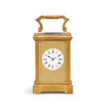 A good early 20th century striking and repeating carriage clock with original leather travel cas...