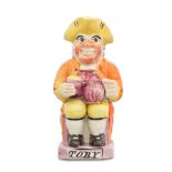 A rare pink lustre 'Postillion' Toby Jug, circa 1820