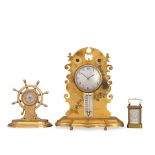 A collection of two aneroid table barometers and a compendium mantel clock