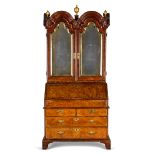 A Queen Anne or George I walnut, crossbanded and featherbanded bureau cabinet 1710-1725, some el...