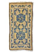 A small Chinese rug 154cm x 78.5cm