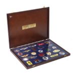 A cased display of 'Badges of The World's Great Motor Cars' by Danbury Mint,