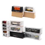 Fourteen boxed 1:43 scale models of race team transporters and other transport vehicles by Premi...