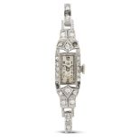 Universal Watch. A very fine and elegant lady's Art Deco platinum and diamond set manual wind coc...