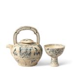 A BLUE AND WHITE 'TRICK' STEM CUP AND A TEAPOT AND COVER Vietnam, 15th century and 16th century (3)