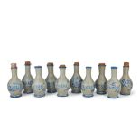 A collection of ten grey painted clay apothecary bottles Season 3, Episode 7, 'Crème de Men...