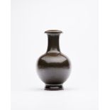 A TEA-DUST-GLAZED BOTTLE VASE Late Qing Dynasty