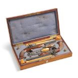 A cased pair of French target or duelling pistols signed bruneel à lyon