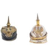 AN IMPERIAL GERMAN GUARDE OFFICER'S SPIKED HELMET AND A MID-19TH CENTURY IMPERIAL KURASSIER HELMET.