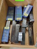 Assorted Kennametal insert holders and carbide inserts.