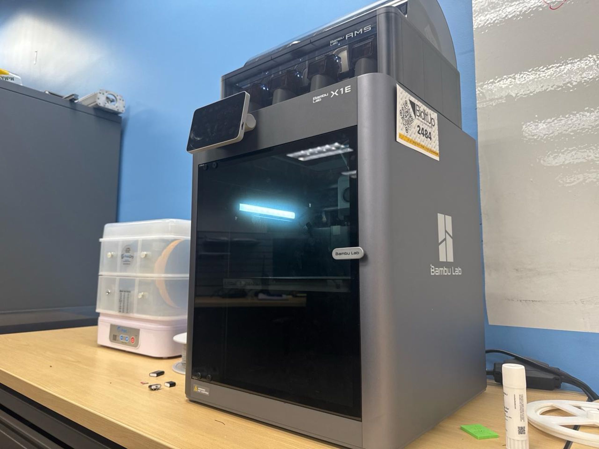 3D printer with material system; The Bambu Lab X1E (X1-Enterprise) is a ...