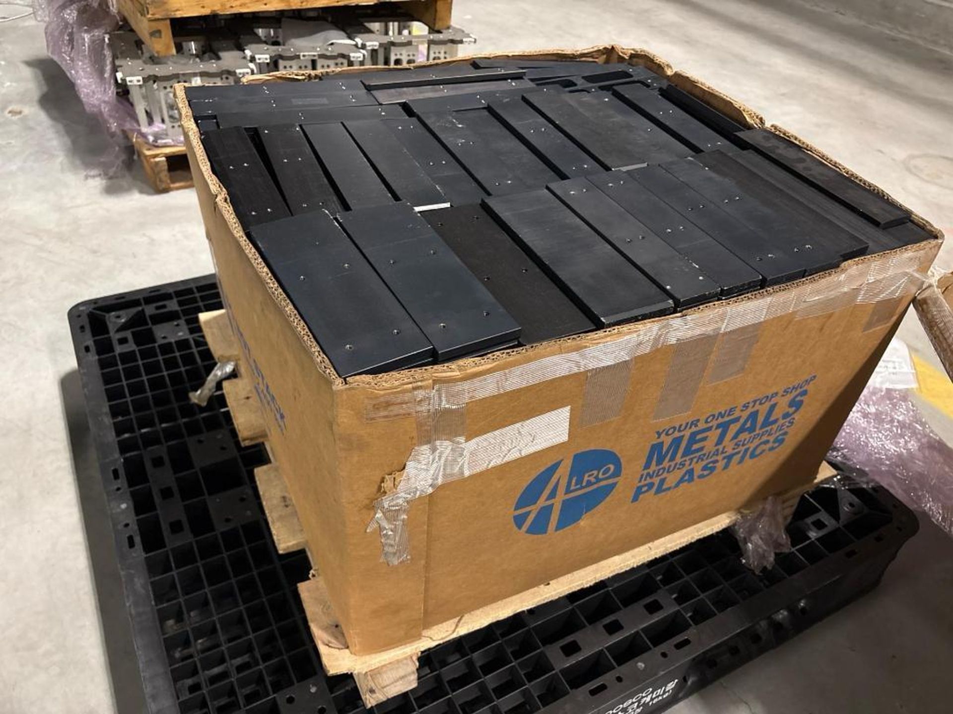 Pallet Edge Riser Black Anodized Aluminum mounting blocks and risers. ; Pallet of heavy ...