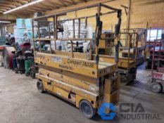 HAULOTTE MODEL 2632E ELECTRIC SCISSOR LIFT; S/N CE502508, 90" LONG X 30" WIDE DECK WITH 61" SLIDE