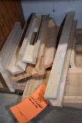 STACK OF WOODEN TABLE SAW JIGS