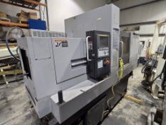 Tsugami Precision Lathe with bar feeder and chip conveyor - Brockton Plant Location