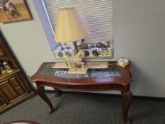 Side Table with Lamp and Various Figurines