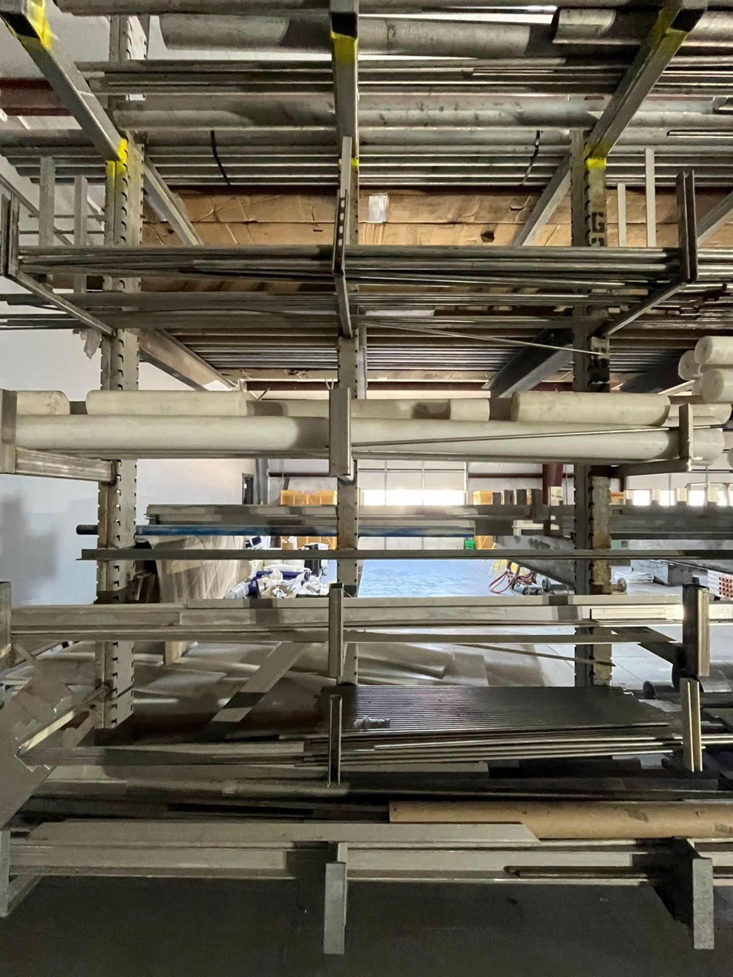 Material on Cantilever Rack Facing Blasting Booth (MATERIAL ONLY, RACK)