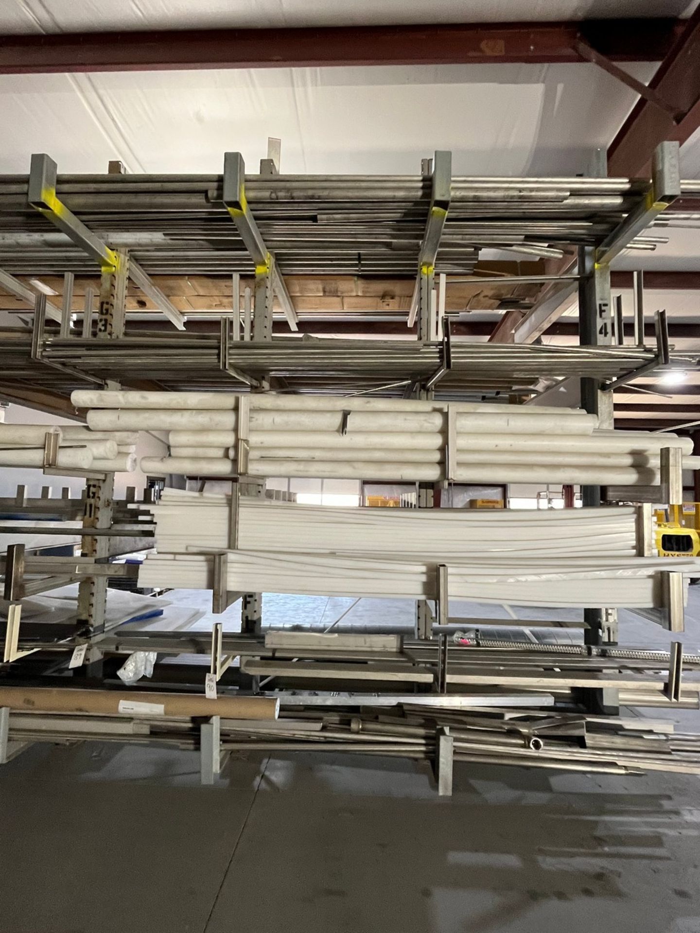 Material on Cantilever Rack Facing Blasting Booth (MATERIAL ONLY, RACK)