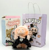 A Pop Mart Macaron 'The Monsters' Labubu Doll with MiuMiu accessories. In excellent condition with
