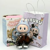 A Pop Mart Macaron 'The Monsters' Labubu Sea Salt Coconut Doll with LV accessories. In excellent