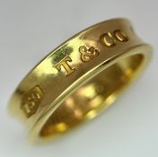 A TIFFANY 18K GOLD BAND RING. SIZE P 1/2 - Q. 8.46gms
