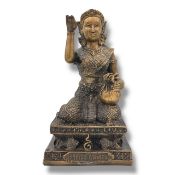 An antique Thai Bronze Kneeling Deity Figure Holding a Bag with Raised Hand Gesture. Finely cast