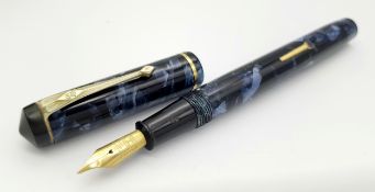 Vintage 1935 CONWAY STEWART FOUNTAIN PEN . Finished in Blue Marble. Complete with 14 CARAT GOLD NIB.