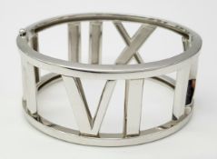 A TIFFANY 18K WHITE GOLD BANGLE WITH ROMAN NUMERALS . 80.9gms