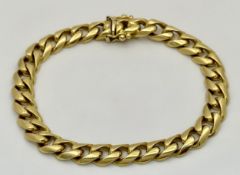 A TIFFANY AND CO 18K GOLD CURB LINK BRACELET WITH BOX CLASP . 40gms 19cms