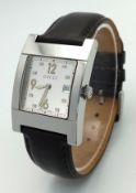 A Gucci 7700M Stylish Quartz Unisex Watch. Brown leather strap. Stainless steel tank case - 29 x