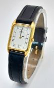 A Seiko Quartz Ladies Watch. Black leather strap. Tank case - 20 x 28mm. White dial. New battery