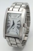 AN EMPORIO ARMANI, STEEL BRACELET WATCH. MODEL AR 0145. IN FULL WORKING ORDER. NEW BATTERY FITTED