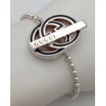 A Designer Gucci Monogram Ball-Link Silver Bracelet. 17cm. Comes with, pouch, box and coa card.