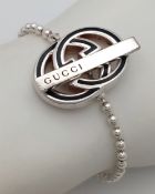 A Designer Gucci Monogram Ball-Link Silver Bracelet. 17cm. Comes with, pouch, box and coa card.